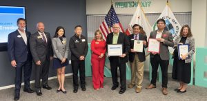 Bruce Greenberg - Lifetime Member Award Presentation at the Greater Irvine Chamber Annual Members Meeting 2026.L-R: Greater Irvine Chamber President & CEO Dave Coffaro, Irvine Vice Mayor James Mai, Irvine Council members Melnda Liu, William Go, and Betty Martinez Franco, Bruce Greenberg, Al Tello representing the office of OC Supervisor Don Wagner, John Ding representing the office of State Senator Steven Choi, Lillian Hollar representing the office of Assemblywoman Cottie Petrie-Norris.